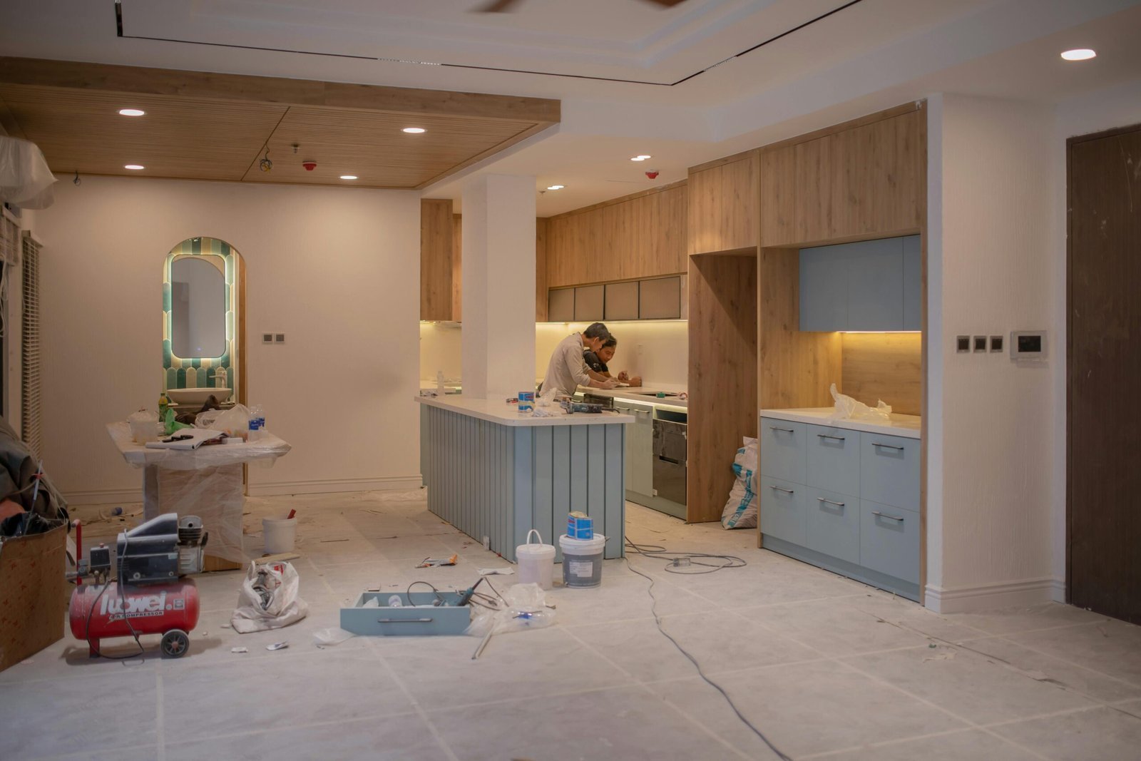 A professional contractor providing home maintenance services in a modern residential house.